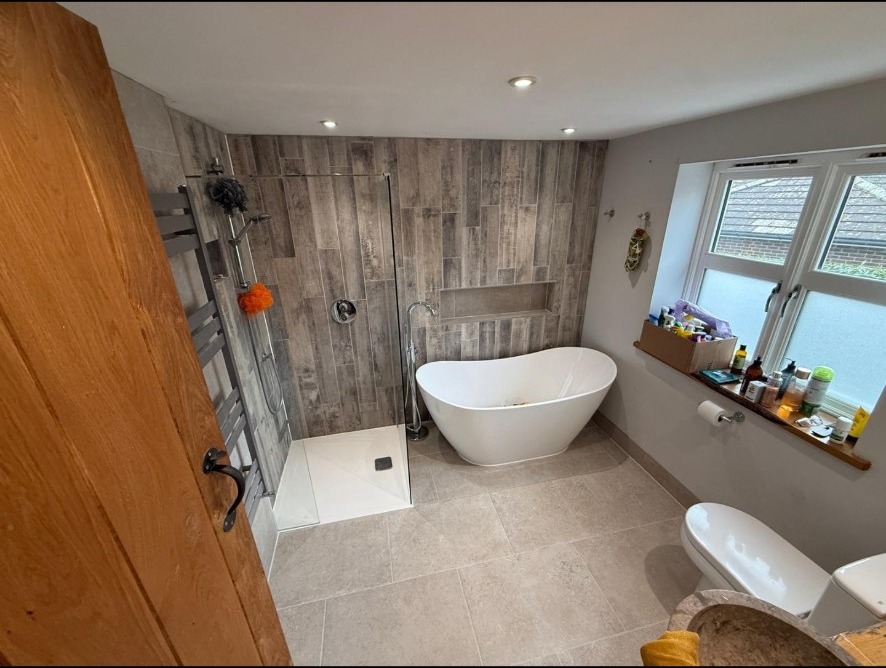 A bath and walk-in shower under the roofline.